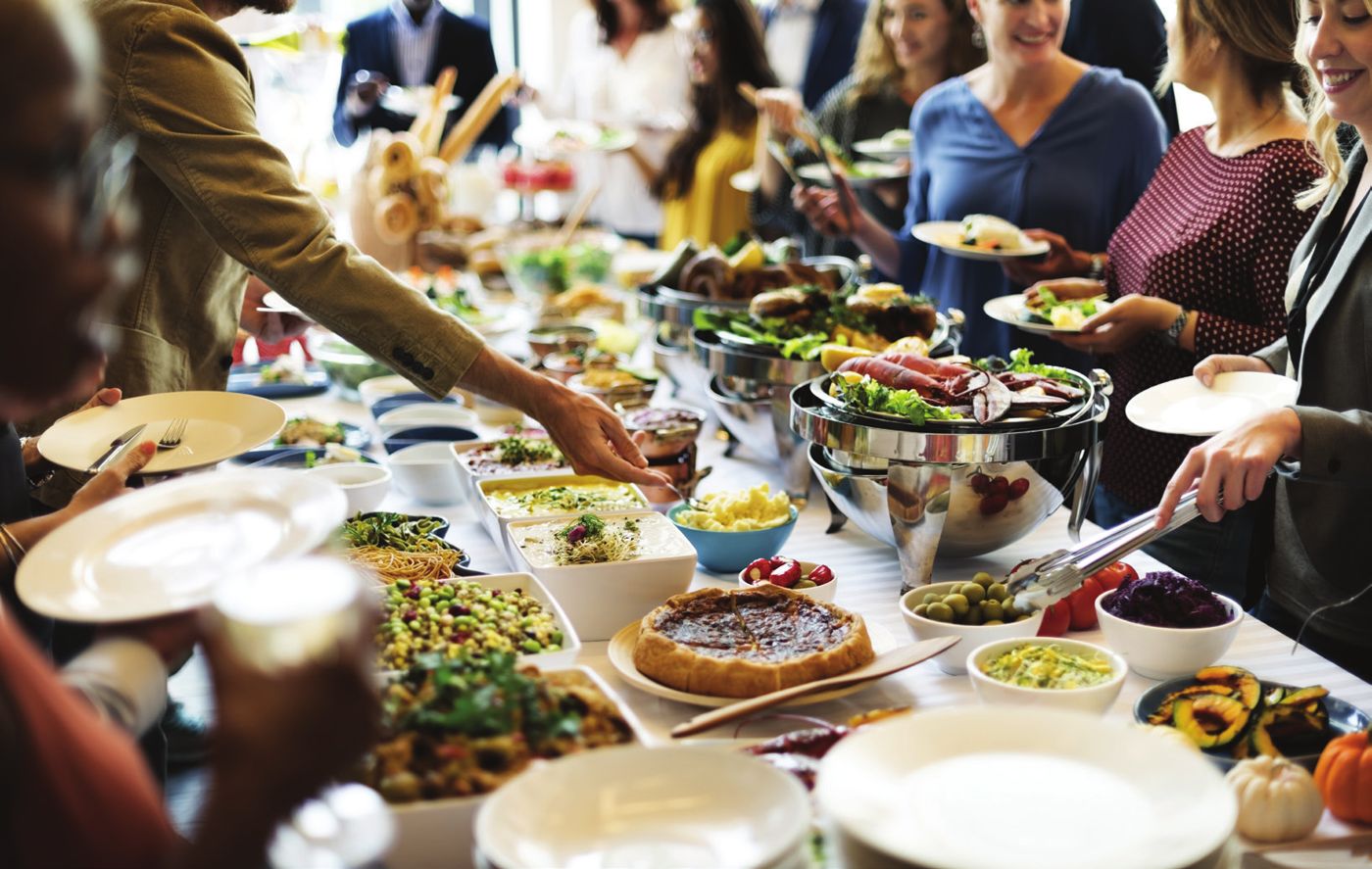 A table spread with Café Va Bene catering platters